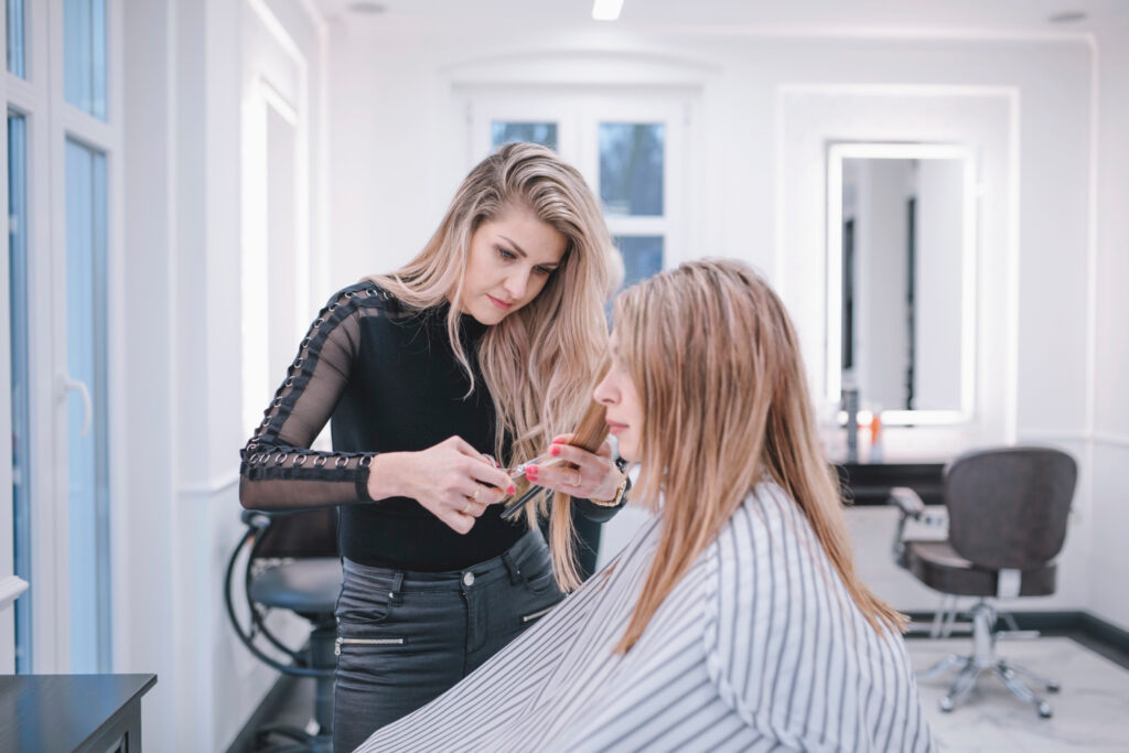 professional-stylist-doing-haircut-salon